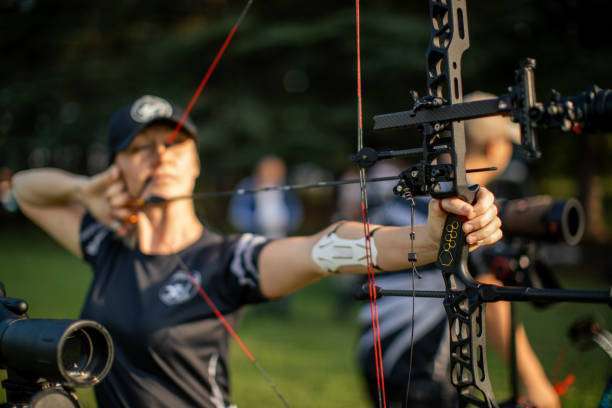 Woman female archer with a compound bow
