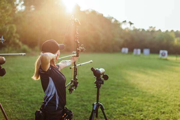 woman female archer with a compound bow