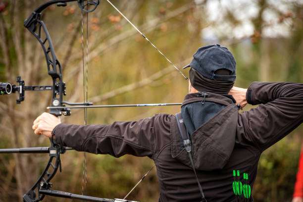 archer aiming with a hunting compound bow